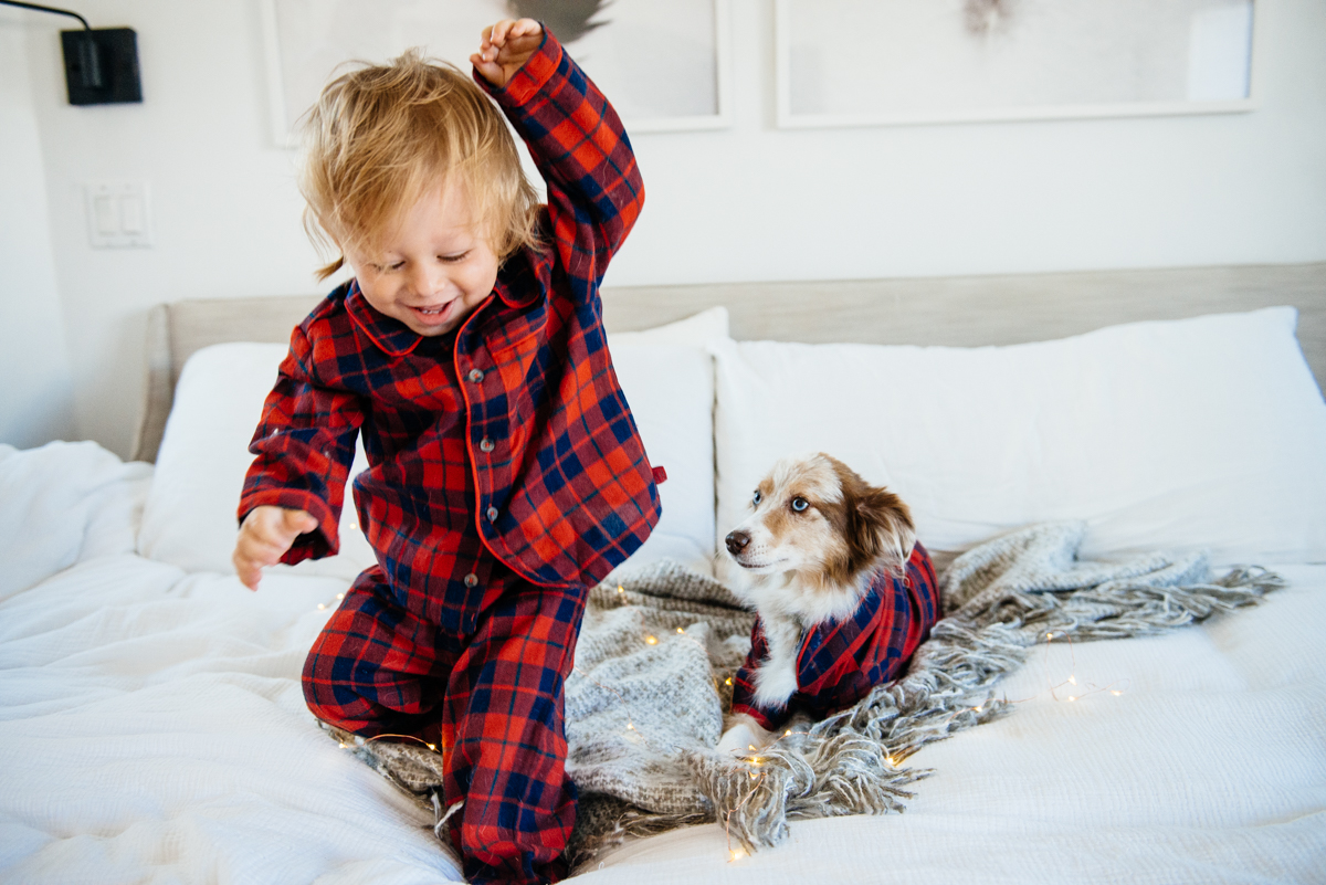 Kimberly Lapides of eatsleepwear sharing her favorite kids and toddler pajamas featuring 1212, clover baby & kids, target, gap kids, h&m kids. Showing toddler and dog in matching plaid pajamas from janie and jack.
