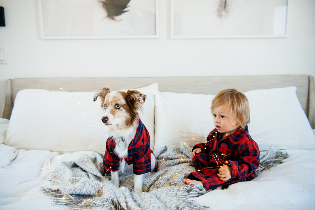 Kimberly Lapides of eatsleepwear sharing her favorite kids and toddler pajamas featuring 1212, clover baby & kids, target, gap kids, h&m kids. Showing toddler and dog in matching plaid pajamas from janie and jack.