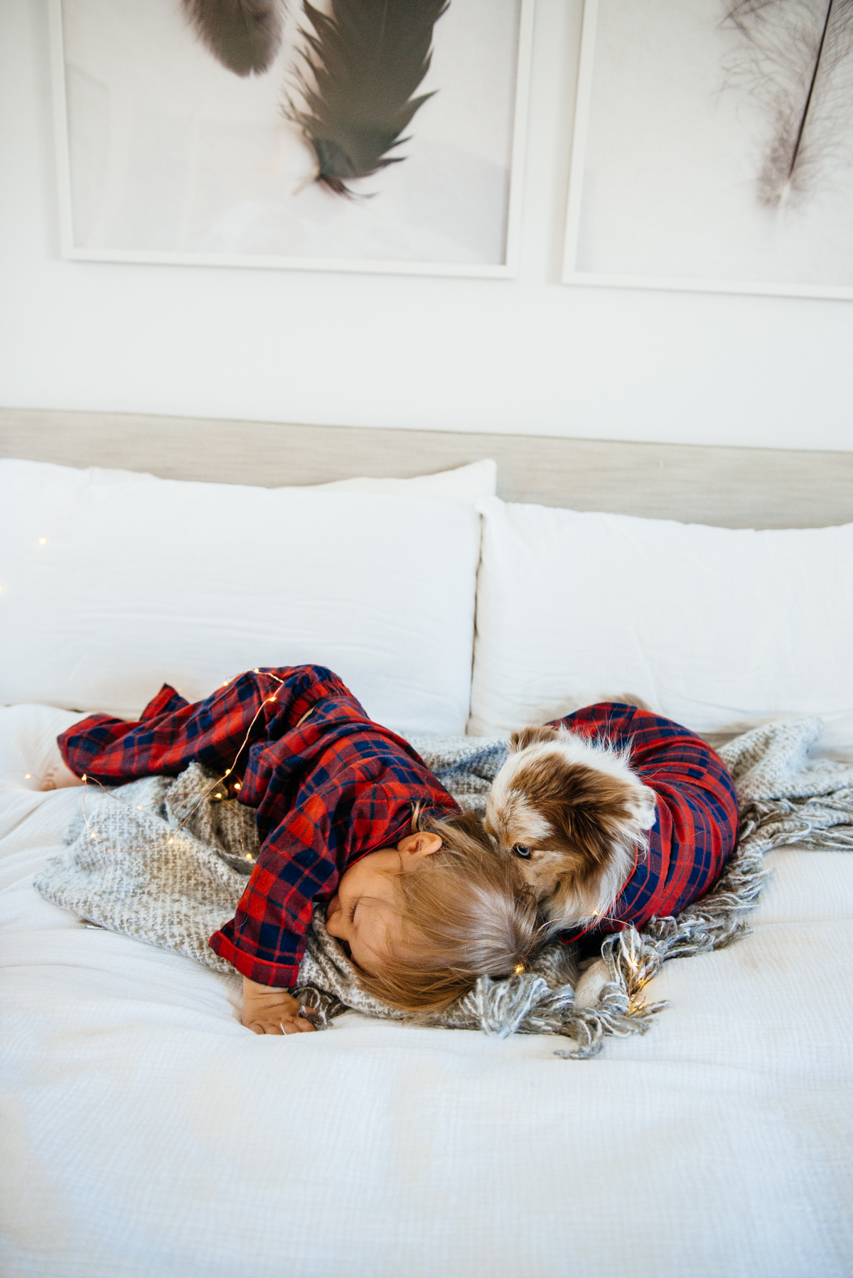 Kimberly Lapides of eatsleepwear sharing her favorite kids and toddler pajamas featuring 1212, clover baby & kids, target, gap kids, h&m kids. Showing toddler and dog in matching plaid pajamas from janie and jack.