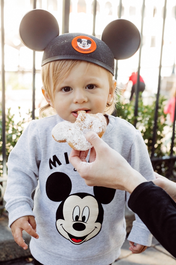 eatsleepwear kimberly lapides The holidays at Disneyland Resort eating sweet snacks like Mickey Mouse beignets in cafe new orleans at mint julep bar.