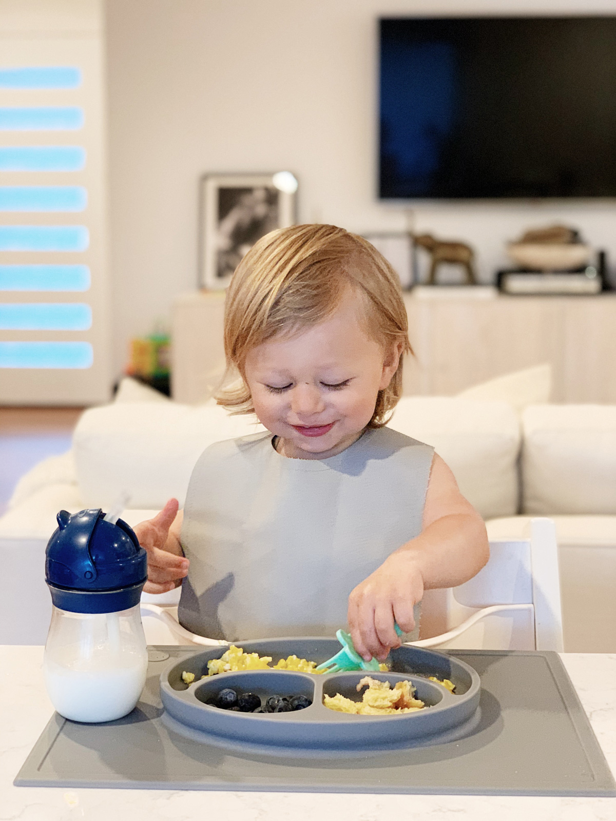 Toddler Feeding Essentials: 18 months featuring stokke tripp trapp highchair, ezpz mat, gathre bib, and oxo tot straw cup for eatsleepwear kimberly lapides