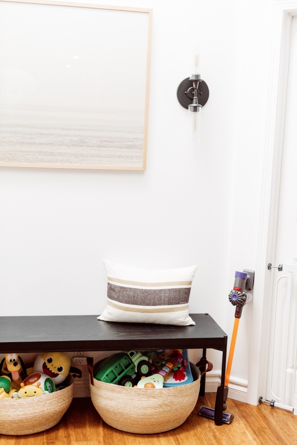 Kids toys organized in baskets with kids dyson vacuum