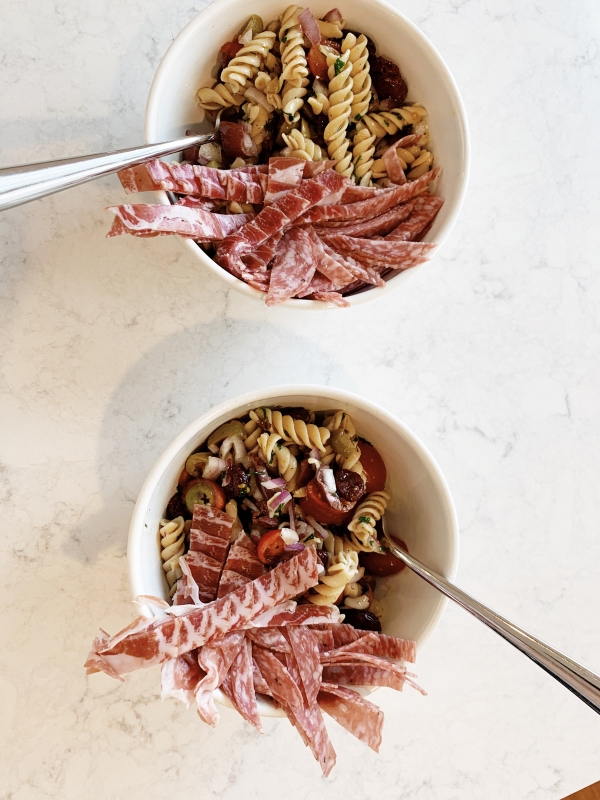 Easy lunch time cold pasta salad recipe with banza pasta with items from your pantry during quarantine by Kimberly Lapides of eatsleepwear