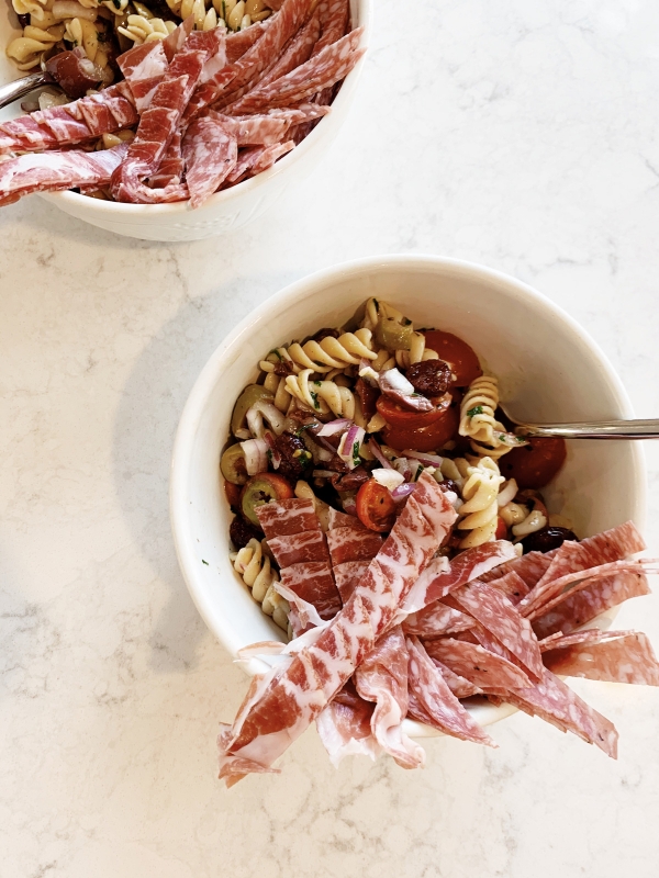 Easy lunch time cold pasta salad recipe with banza pasta with items from your pantry during quarantine by Kimberly Lapides of eatsleepwear