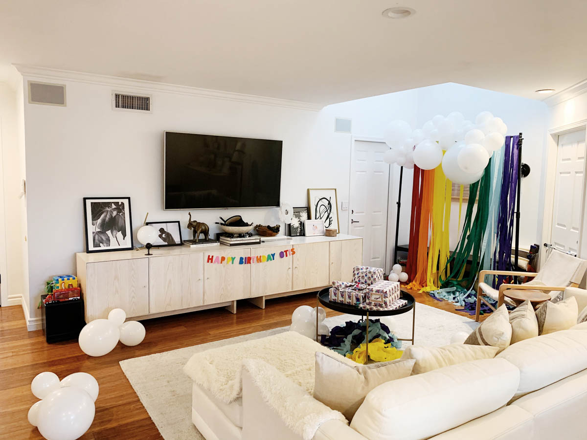 DIY Rainbow and cloud balloon arch with streamer backdrop for Trolls Themed Birthday