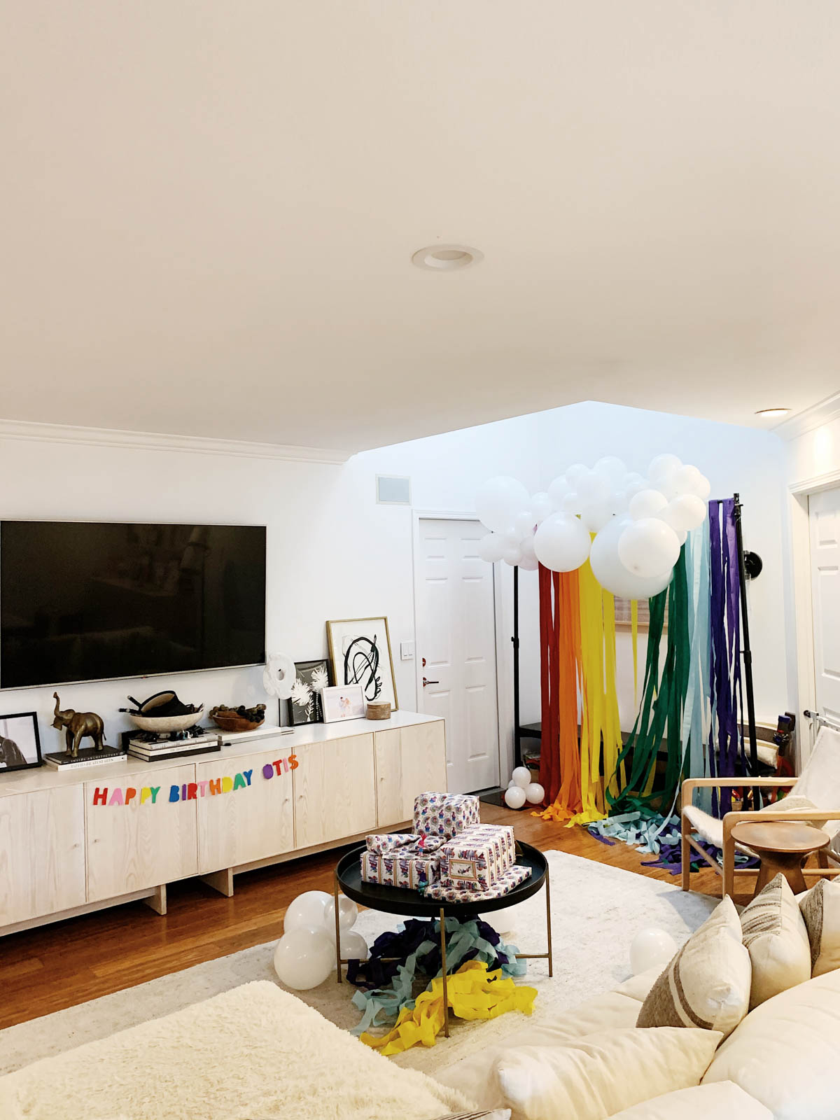 DIY Rainbow and cloud balloon arch with streamer backdrop for Trolls Themed Birthday