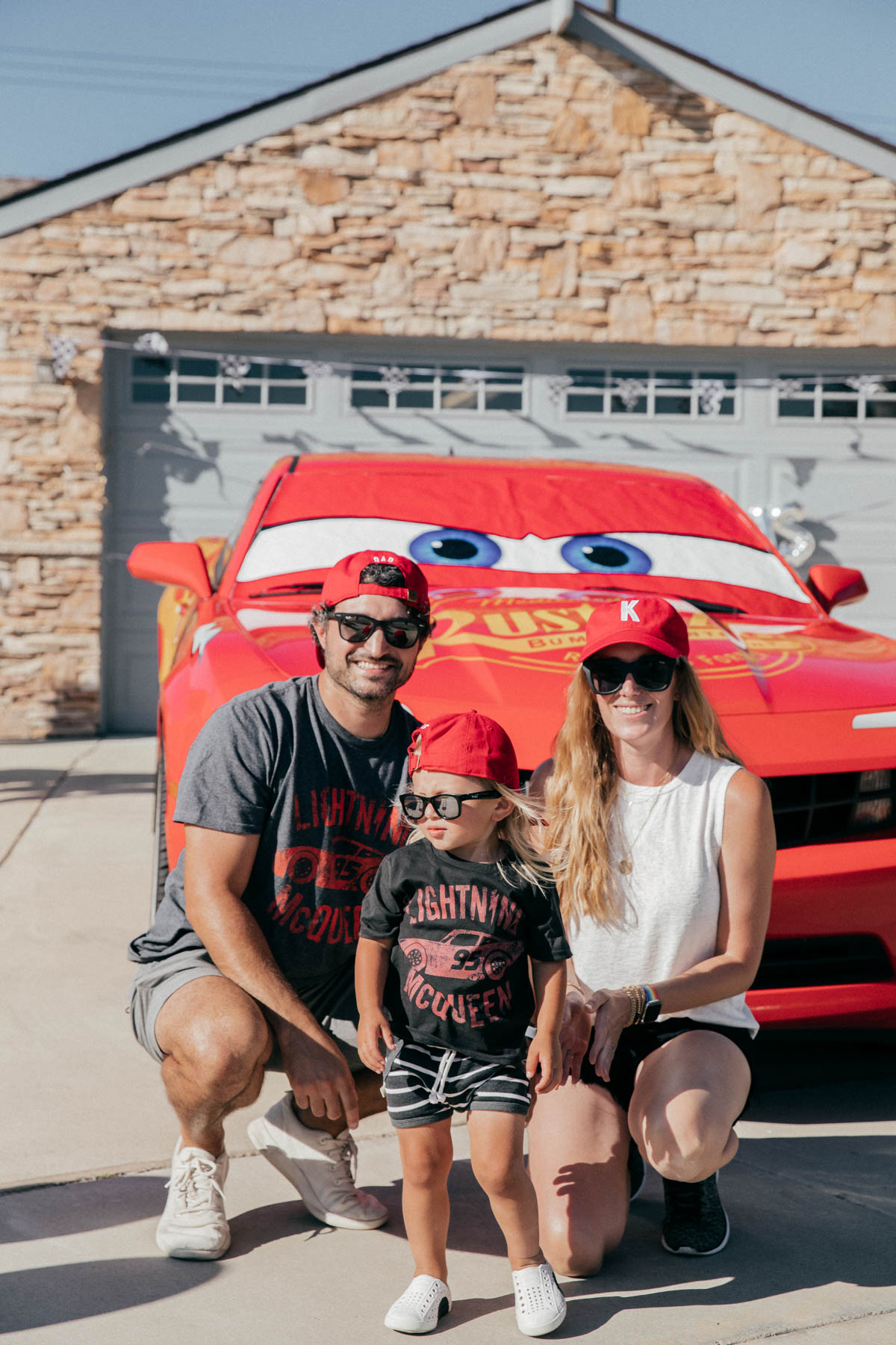 Posing for photo with Lightning McQueen Impersonator Car at Disney Pixar Cars themed birthday