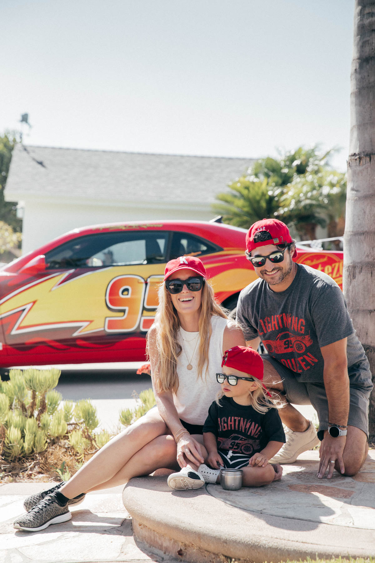 Family photos with Lightning McQueen Impersonator Car at Disney Pixar Cars themed birthday