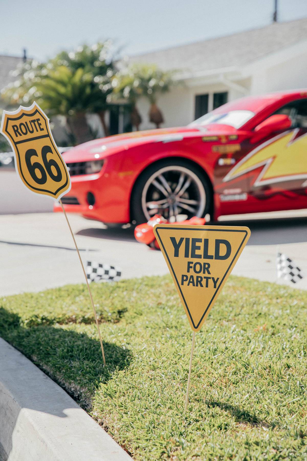Party Decorations and Lightning McQueen Impersonator Car at Disney Pixar Cars themed birthday