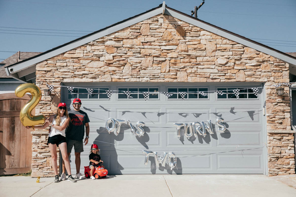 Family photos with balloons at Disney Pixar Cars themed birthday