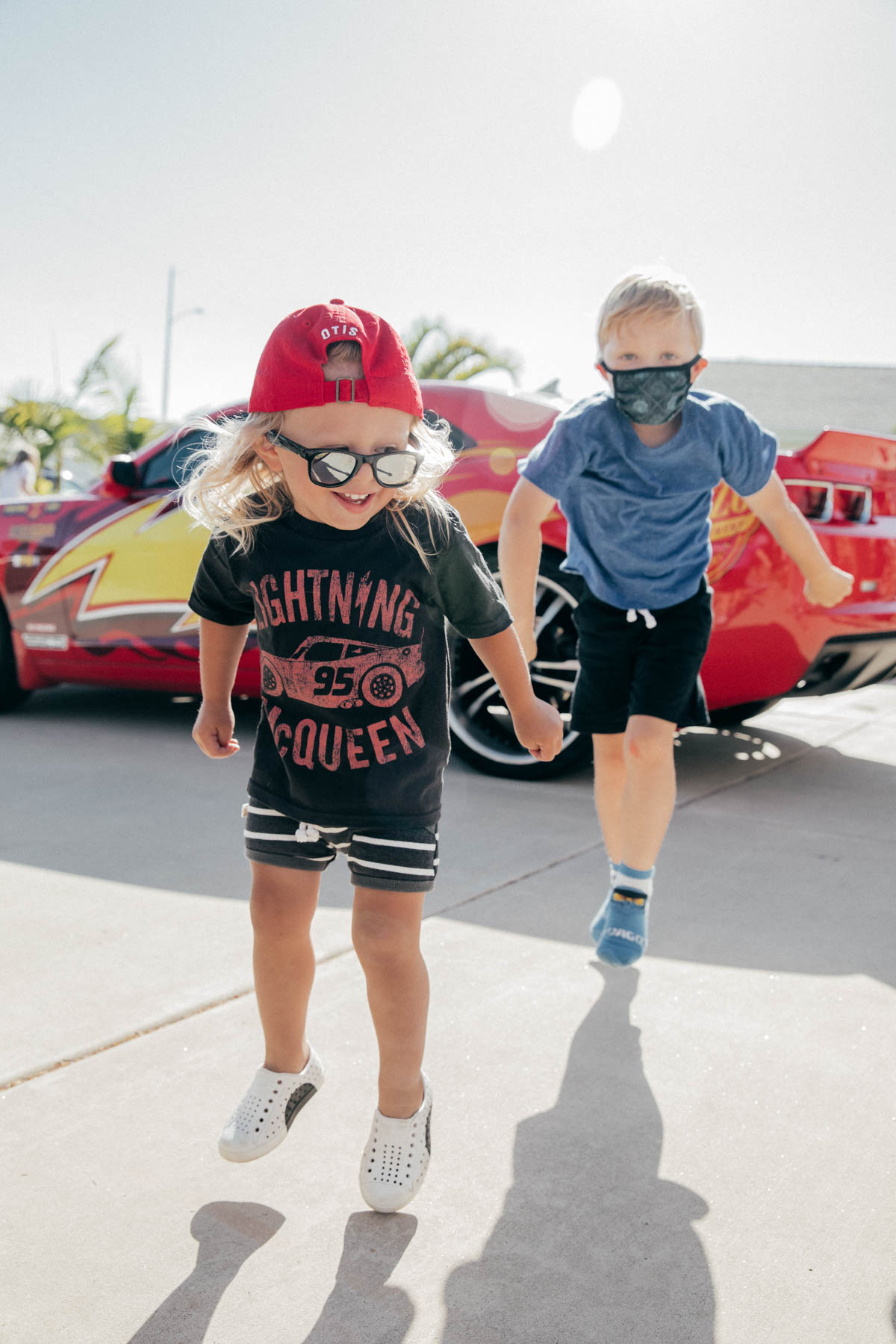 Toddlers dancing in front of Lightning McQueen Impersonator at Disney Pixar Cars themed birthday