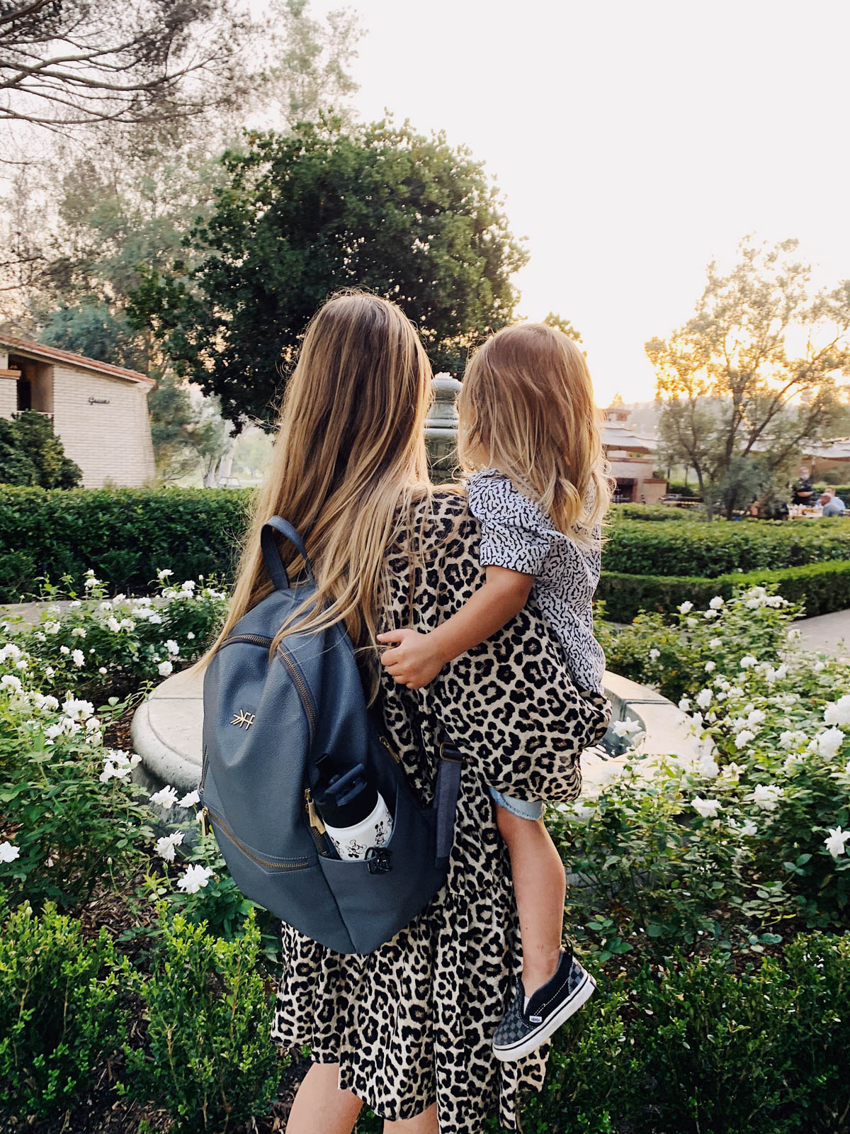 eatsleepwear goes on a family trip with toddler to Rancho Bernardo Inn showing mother and son at fountain