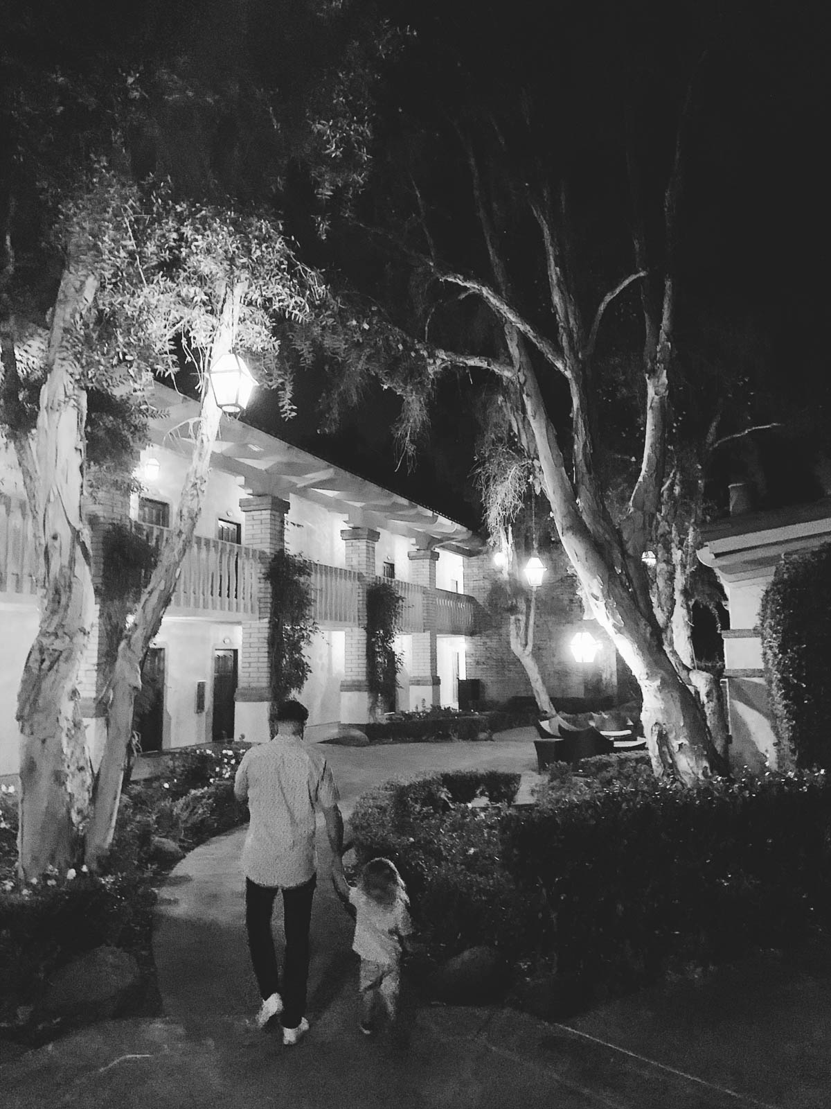eatsleepwear goes on a family trip with toddler to Rancho Bernardo Inn showing father and son walking at night