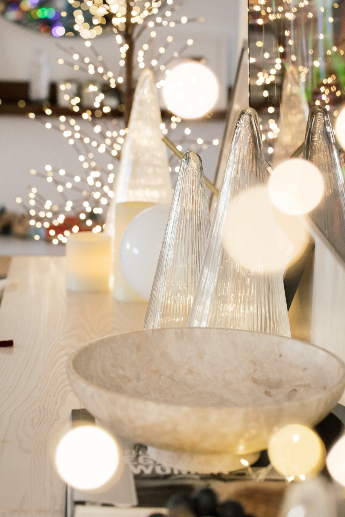 Indoor Holiday decor of twinkle lights tree, twinkle lights, clear glass Christmas tree cloche