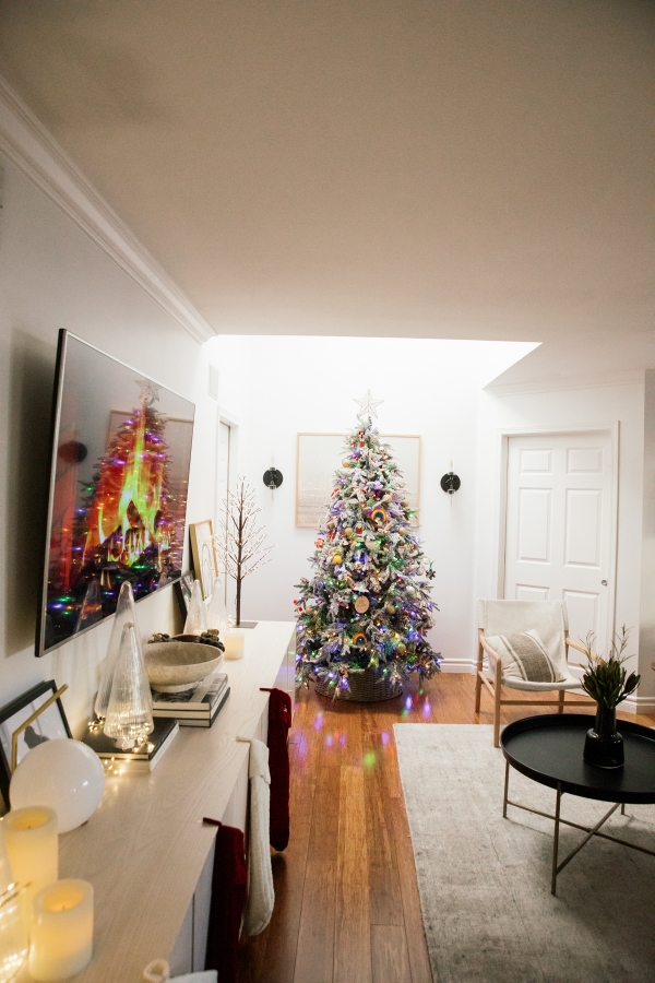 Indoor Holiday decor of twinkle lights tree, twinkle lights, clear glass Christmas tree cloche, and custom embroidered stockings and lit Christmas Tree