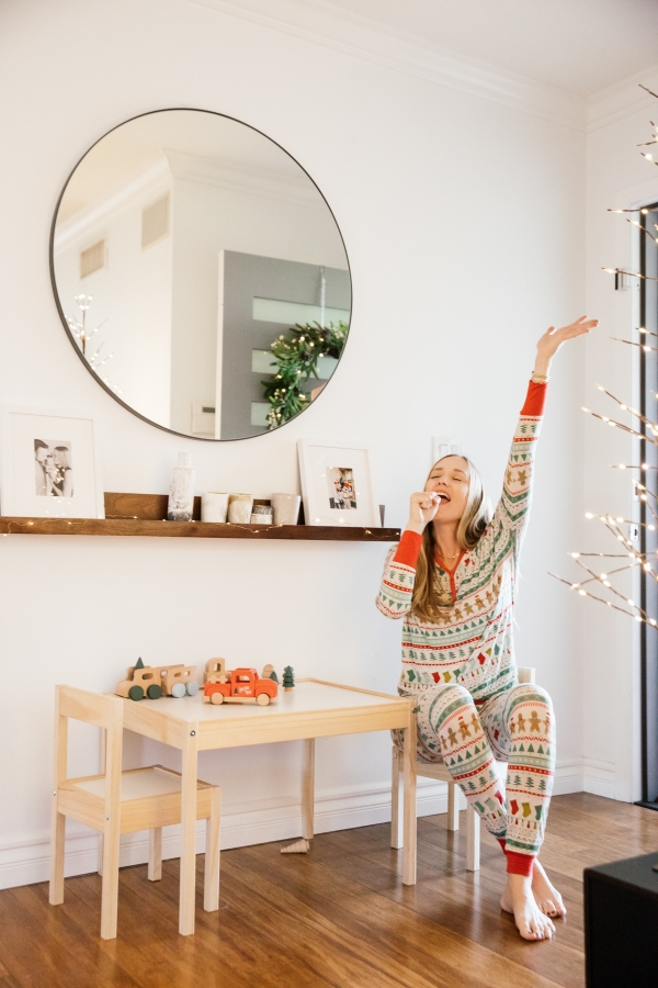 Indoor Holiday decor and Mom singing Christmas Songs in Christmas Pajamas