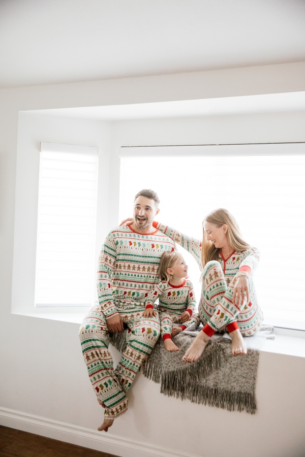 Family in matching Holiday pajamas