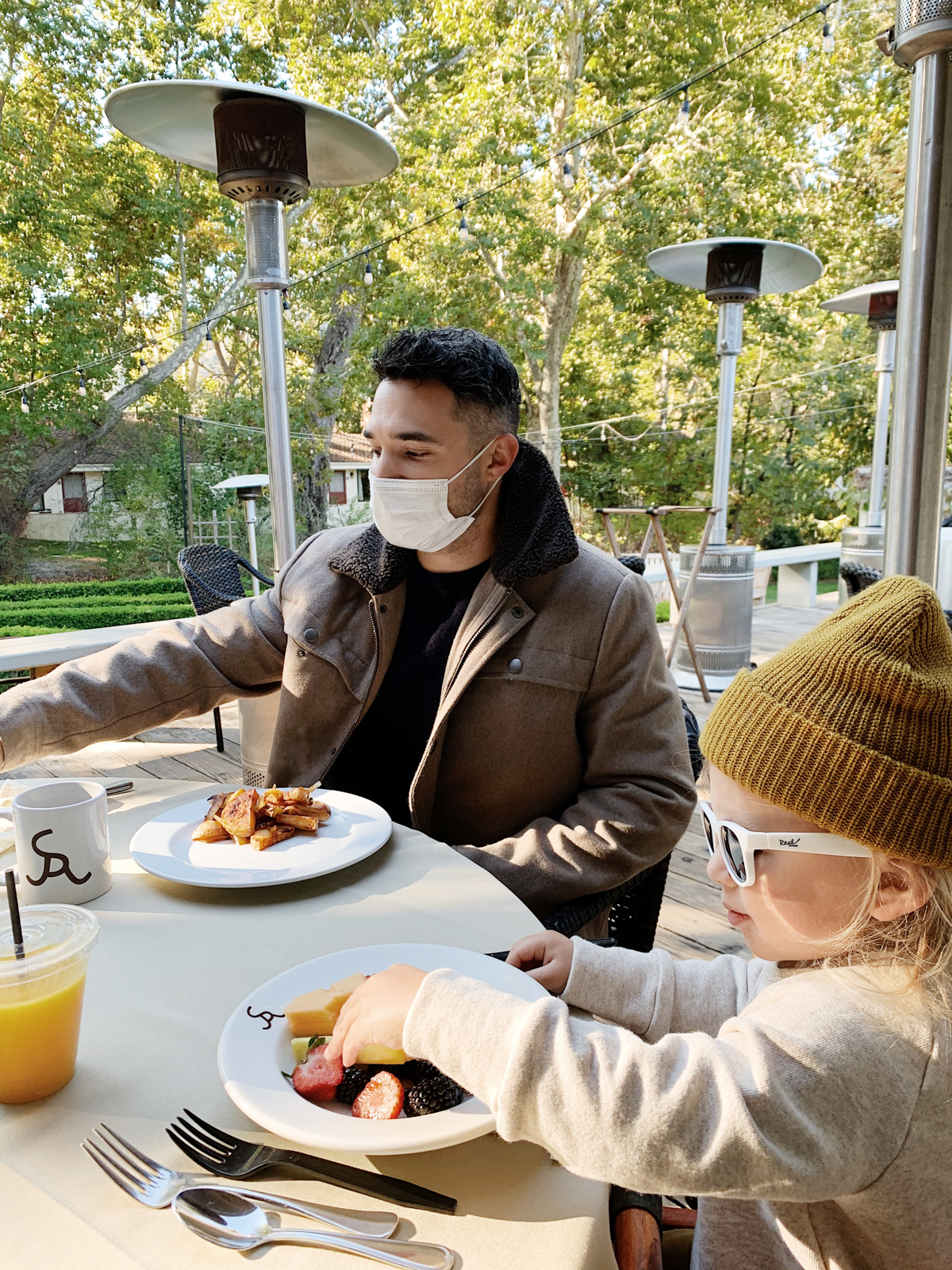 Father and son eating breakfast outside at Alisal Guest Ranch and Resort 
